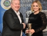 Paddy Kelly presents Noeleen O'Kane with the Ciara McLaughlin Award for Camogie Player of the Year.